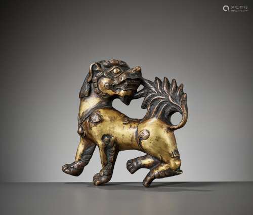 A MASSIVE GILT BRONZE RELIEF OF A BUDDHIST LION, 17TH-18TH C...