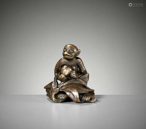 A 'MONKEY AND PEACH' BRONZE WEIGHT, MING DYNASTY