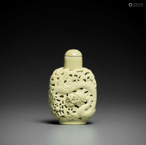 A CARVED YELLOW-GLAZED 'DRAGON' SNUFF BOTTLE, ATTRIBUTED TO ...