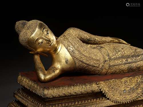 A LARGE GILT BRONZE 'PARINIRVANA' FIGURE OF THE RECLINING BU...