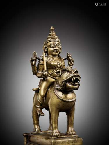 A BRONZE FIGURE OF DURGA RIDING A LION, INDIA, 15TH CENTURY