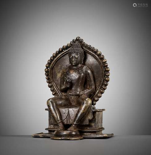 A BRONZE FIGURE OF BUDDHA ON A THRONE