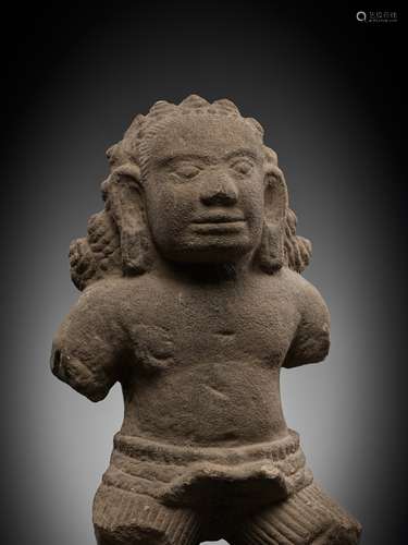 AN EXPRESSIVE SANDSTONE FIGURE OF A RAKSHASA, ANGKOR PERIOD,...