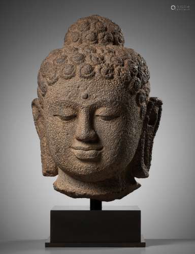 A LARGE ANDESITE HEAD OF BUDDHA, INDONESIA, CENTRAL JAVA, 9T...