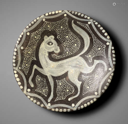 A RARE AND IMPRESSIVE SLIP-DECORATED 'LEOPARD' POTTERY BOWL