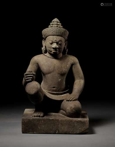 A SANDSTONE GUARDIAN FIGURE DEPICTING A YAKSHA, KOH KER STYL...