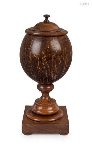 An antique treen ware and coconut urn, 18th/19th century, 26...
