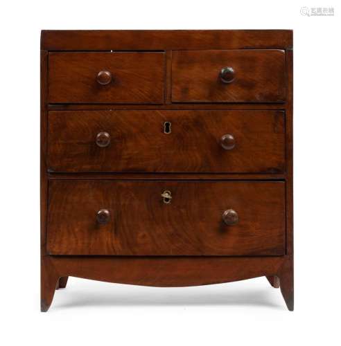 An antique English mahogany apprentice chest of drawers in t...