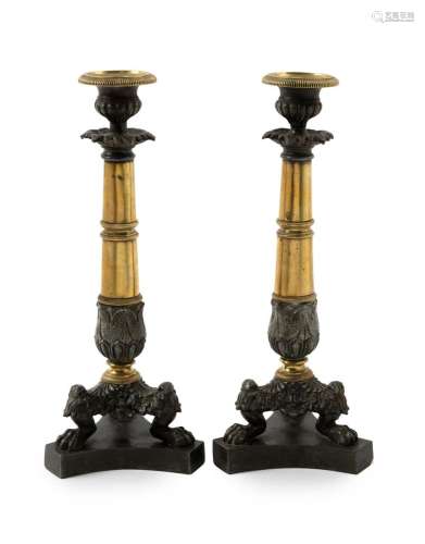 A pair of antique French Empire style candlesticks, cast spe...