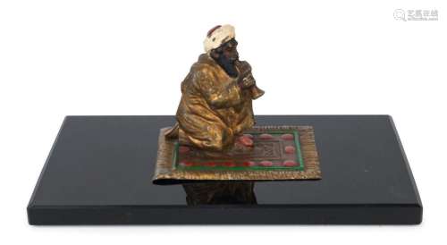 An Austrian cold painted bronze statue of an Arab sitting on...