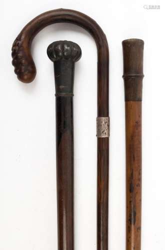 Three assorted antique walking sticks, 19th and early 20th c...
