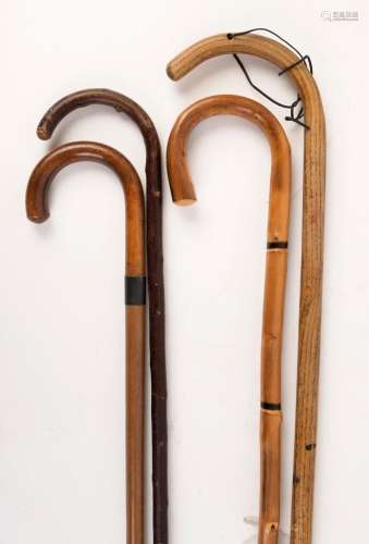 Four assorted walking sticks, 19th and 20th century, the lar...