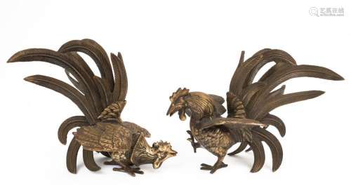 A pair of cast metal cockerel statues, 20th century, the lar...