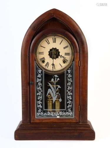 An antique American beehive mantel clock with 8 day time and...