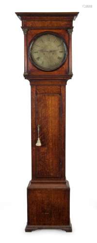 An antique English twin weight long-case grandfather clock w...