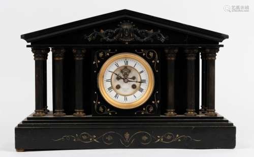 An antique French mantel clock in black slate case with bron...