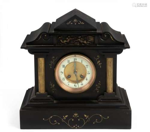 An antique French mantel clock in black slate case with bron...