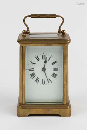 An antique French carriage clock in brass case with Roman nu...