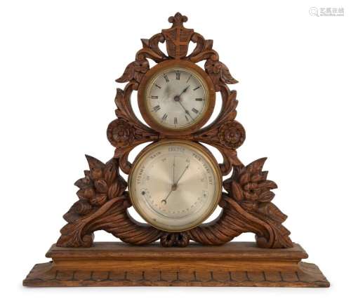An antique weather station clock in ornately carved oak case...
