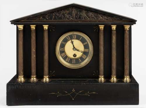 An antique French time only clock in black slate case with g...