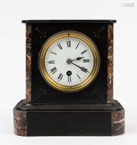 An antique French clock in black slate and marble case, time...