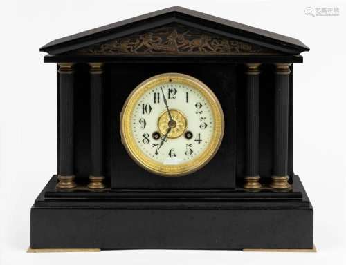 A French mantel clock in an ebonized metal palladium case wi...
