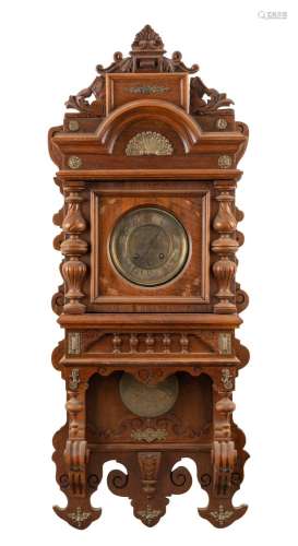 An antique American wall clock in ornate walnut case with gi...