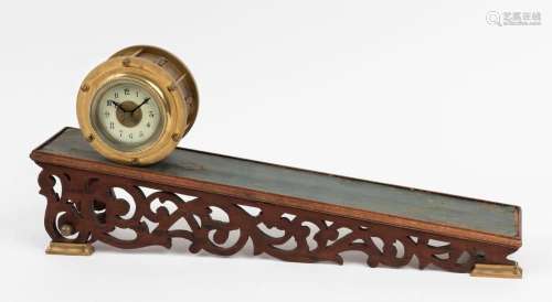 A novelty incline clock, 20th century, the clock 13cm diamet...