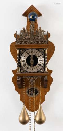 An antique style Dutch twin weight wall clock on oak bracket...