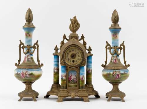 An antique three piece clock set in gilt metal and porcelain...