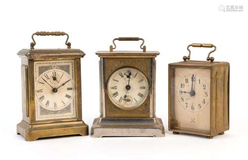 Three carriage style clocks in metal cases, American and Ger...