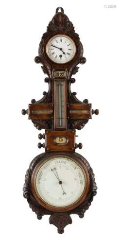 An antique weather station wall clock in ornate oak case wit...