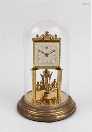 A German 400 day anniversary clock in glass dome with decora...