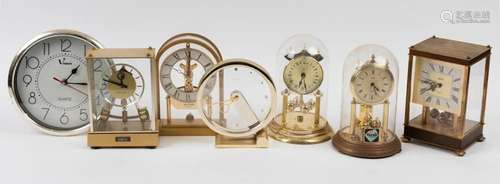 Seven assorted quartz clocks including rolling ball, dome an...