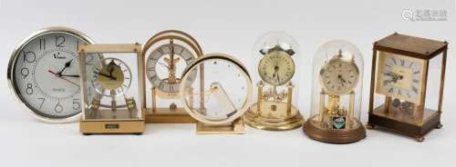 Seven assorted quartz clocks including rolling ball, dome an...