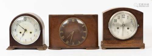 Three vintage clocks including two with timber cases and one...