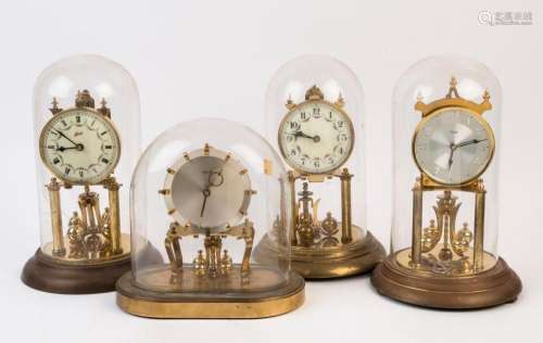 Four vintage anniversary clocks with glass domes, 20th centu...