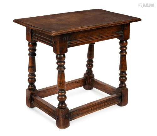 An antique English oak stool with peg joint construction, 19...