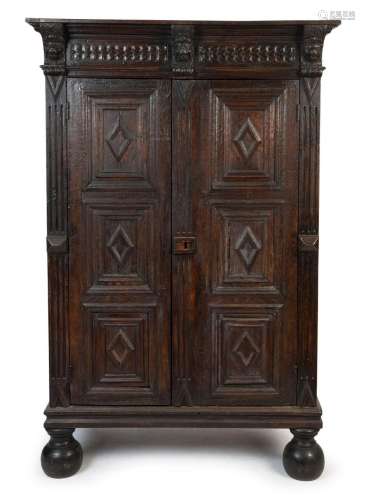 An antique oak two door cabinet with peg joint construction ...