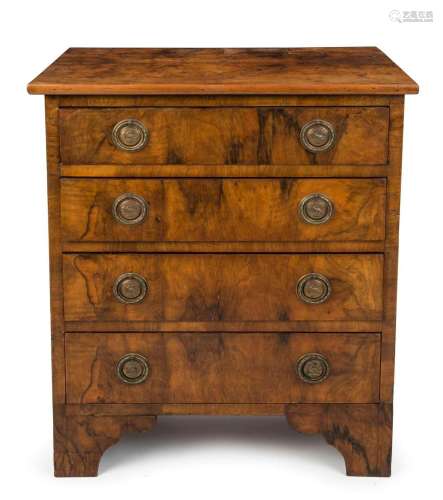 A Georgian dwarf chest of four drawers, walnut veneer with b...