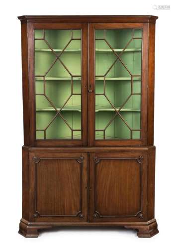 A Georgian mahogany corner display cabinet with astragal gla...