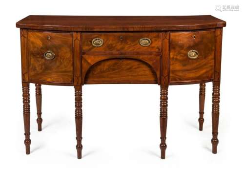 A George III mahogany sideboard with string inlay and six le...