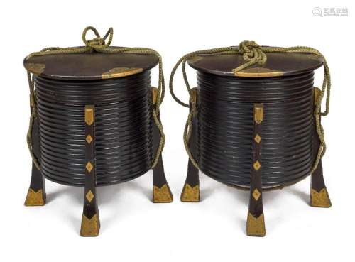 A pair of antique Japanese circular storage boxes, black lac...
