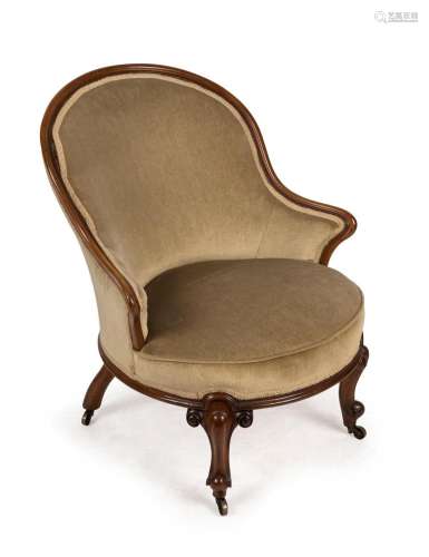 An antique English walnut armchair with olive green velvet u...