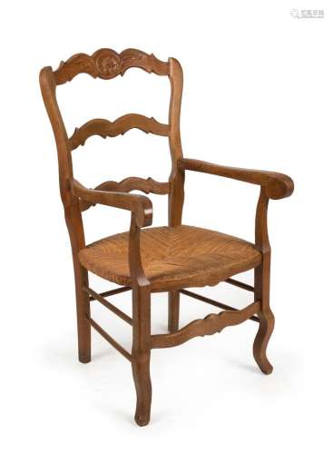 A French provincial oak carver chair with rush seat, 19th ce...