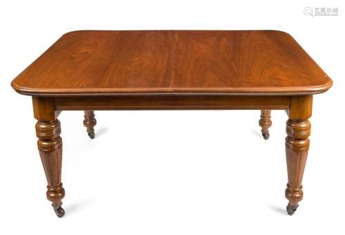 An antique mahogany two leaf extension dining table with tur...