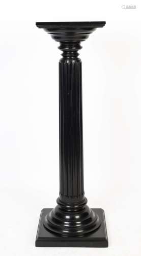 An antique reeded pedestal with ebonised finish, 122cm high,...