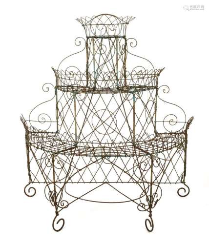 An antique English wirework plant stand, demi-lune form with...