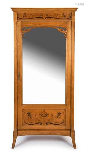 A French Art Nouveau armoire with marquetry decoration, circ...