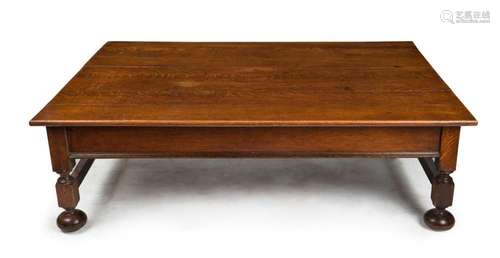 A Tudor style English oak coffee table, 40cm high, 130cm wid...